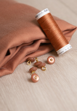 Bouton à coudre en nacre Wink Glossy 10 mm - Plusieurs couleurs