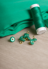 Bouton à coudre en nacre Wink Glossy 10 mm - Plusieurs couleurs