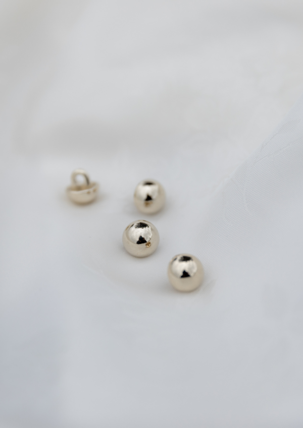 Light gold jewelry button