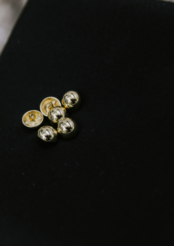 Light gold jewelry button